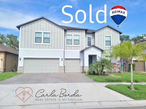 Carla Borda - RE/MAX Realty Unlimited